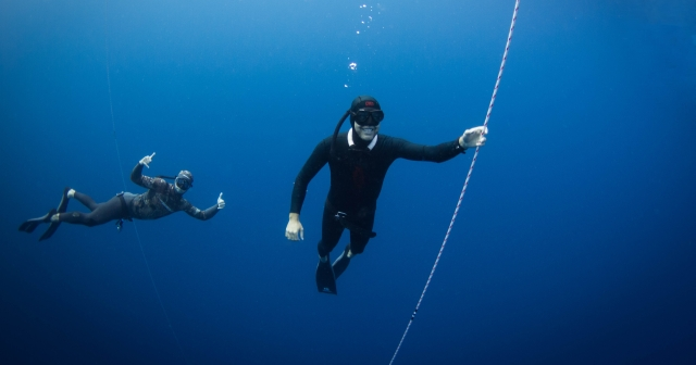 two divers under water