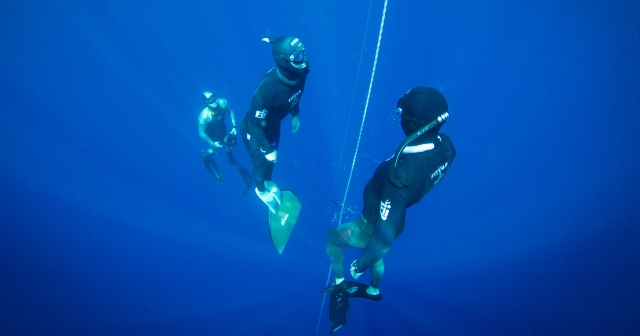 two divers under water